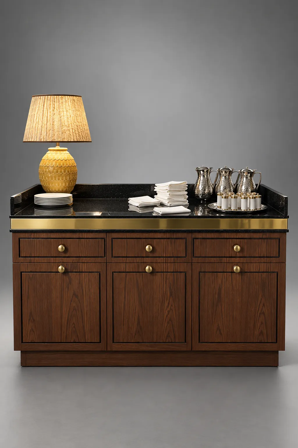 Walnut waiter station with a black stone top, brass trim and a table lamp