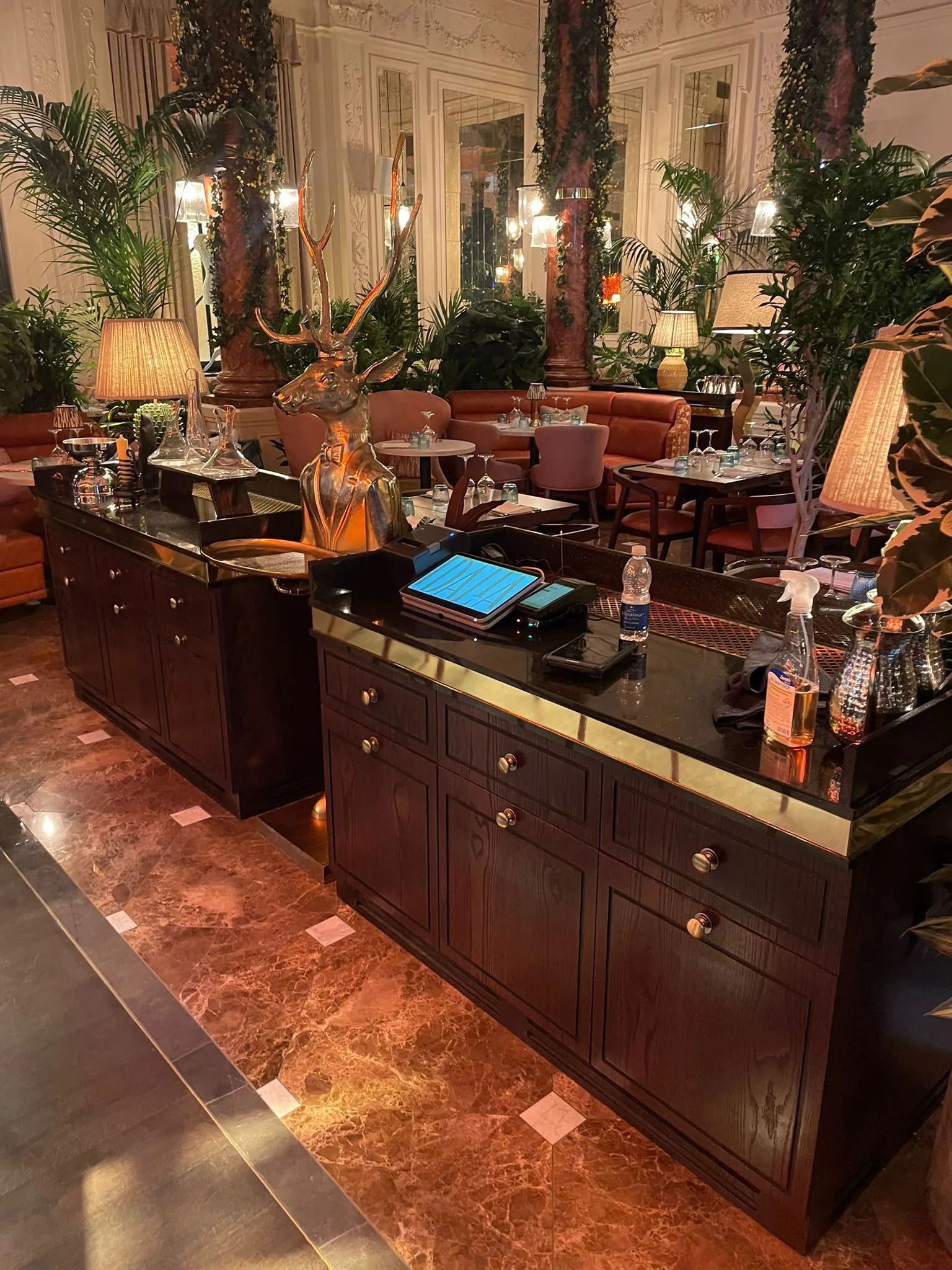 Pair of waiter stations with tills in a restaurant dining room